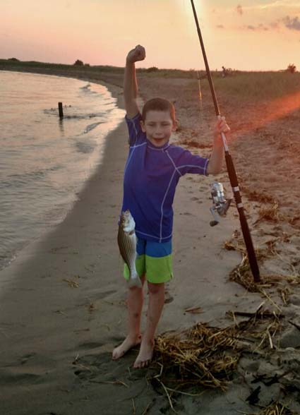 Ryan Johnson, 8 years old, caught many stripers on clams at the mouth of the Merrimack River.
