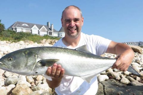 Nick Pacelli holds a big bluefish.