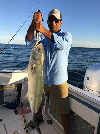 Larry's customer with a nice 36" 15lb+ "gator" bluefish.