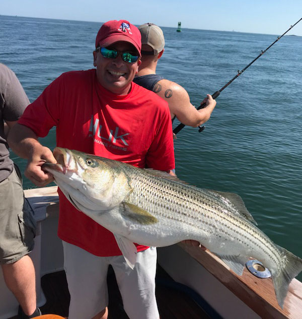 David Langton with a fine harbor striper