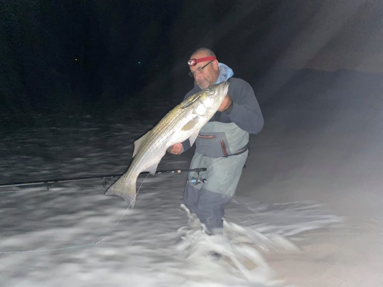 Kevin D. with a 35-inch striped bass caught at Island Beach State Park.