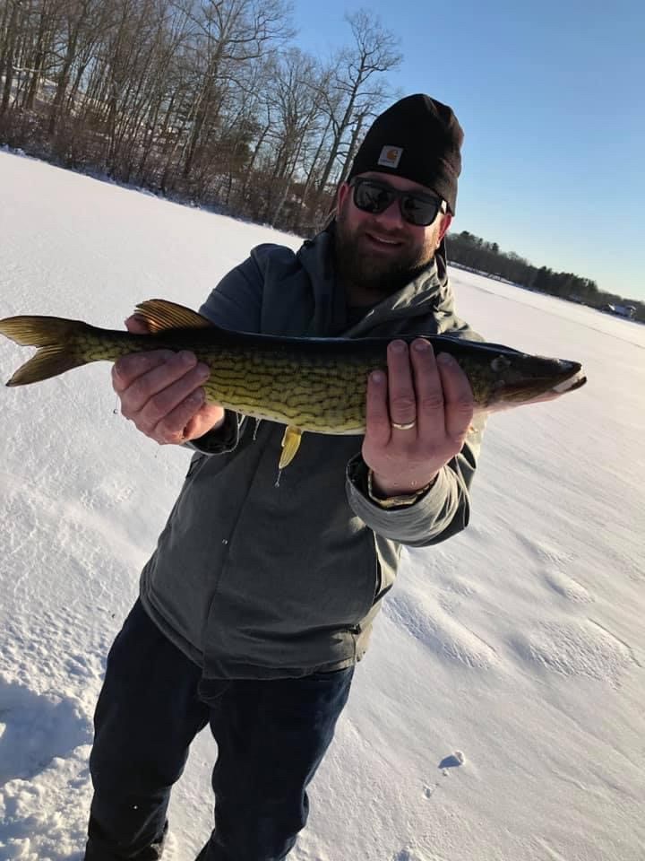 Matthew Holbrook pulled a pickerel through the ice on a recent trip.