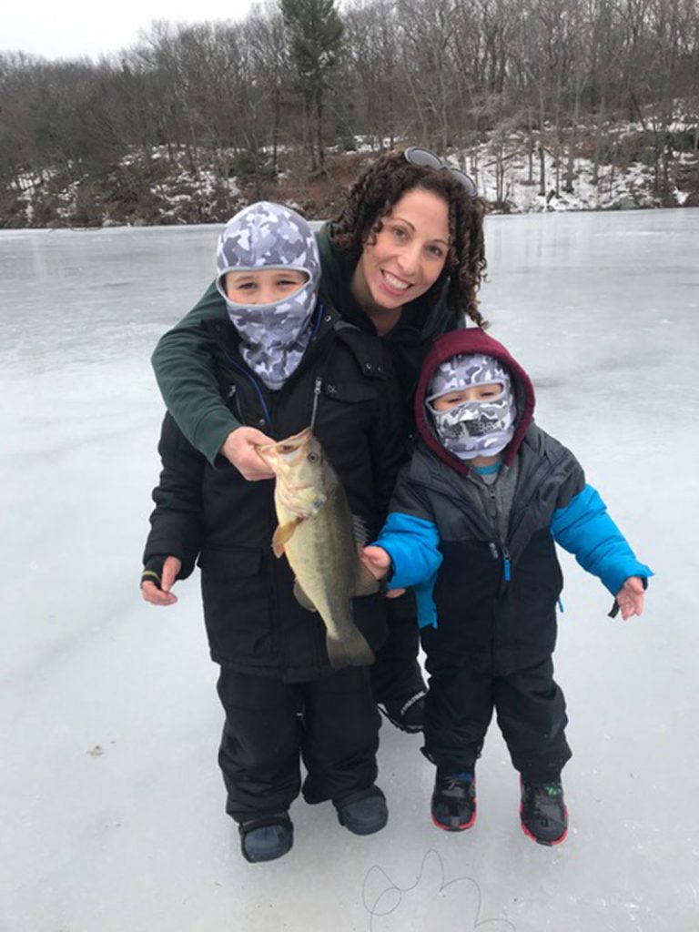 The Paone family with largemouth bass