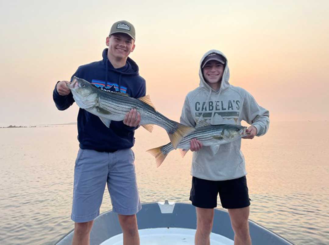 Anglers Matt and Ethan with two nice stripers