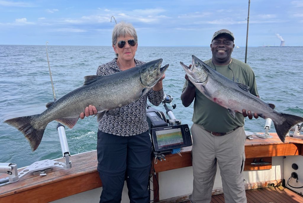 Isiah and Marci with salmon