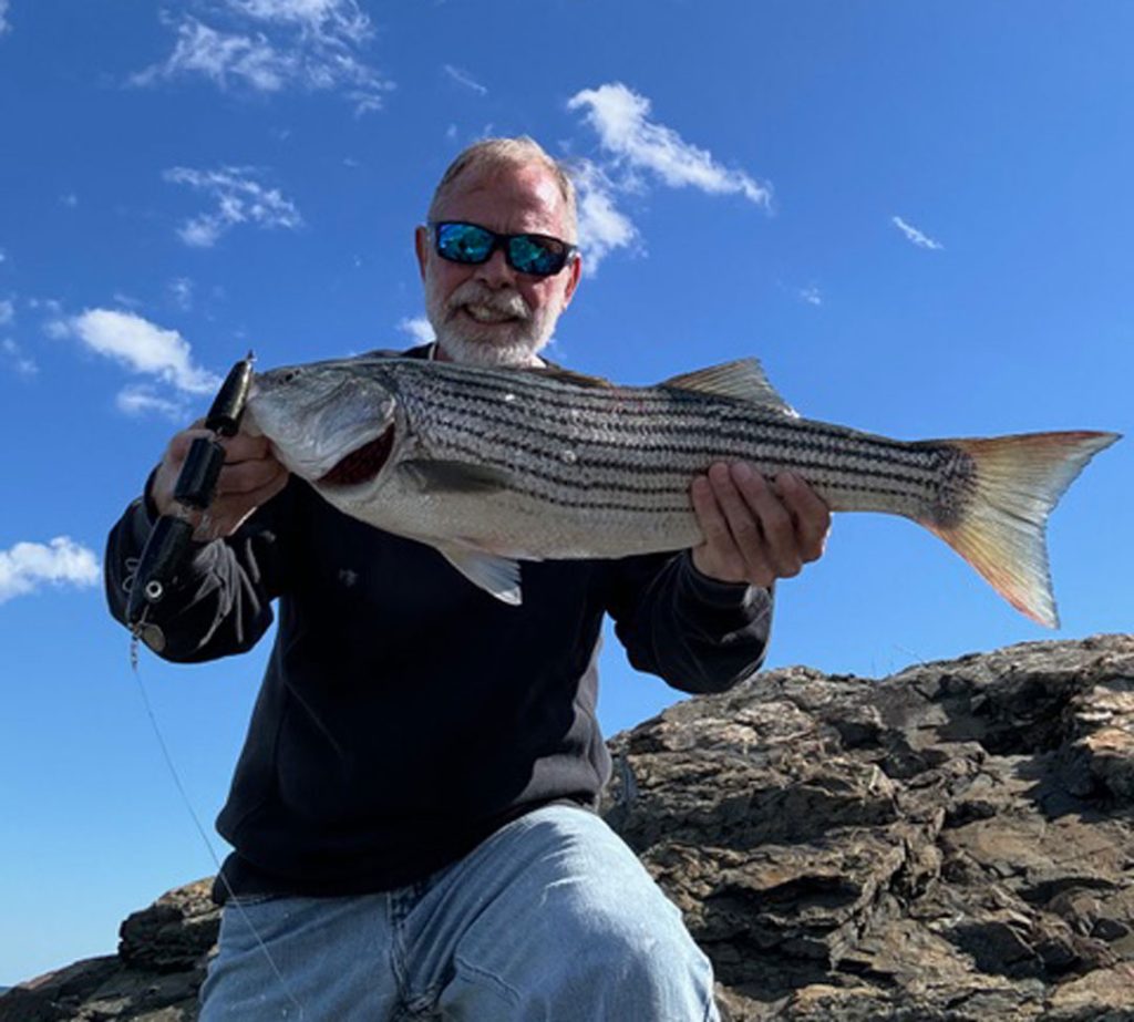 Dave “the Dude” Flaherty with striped bass