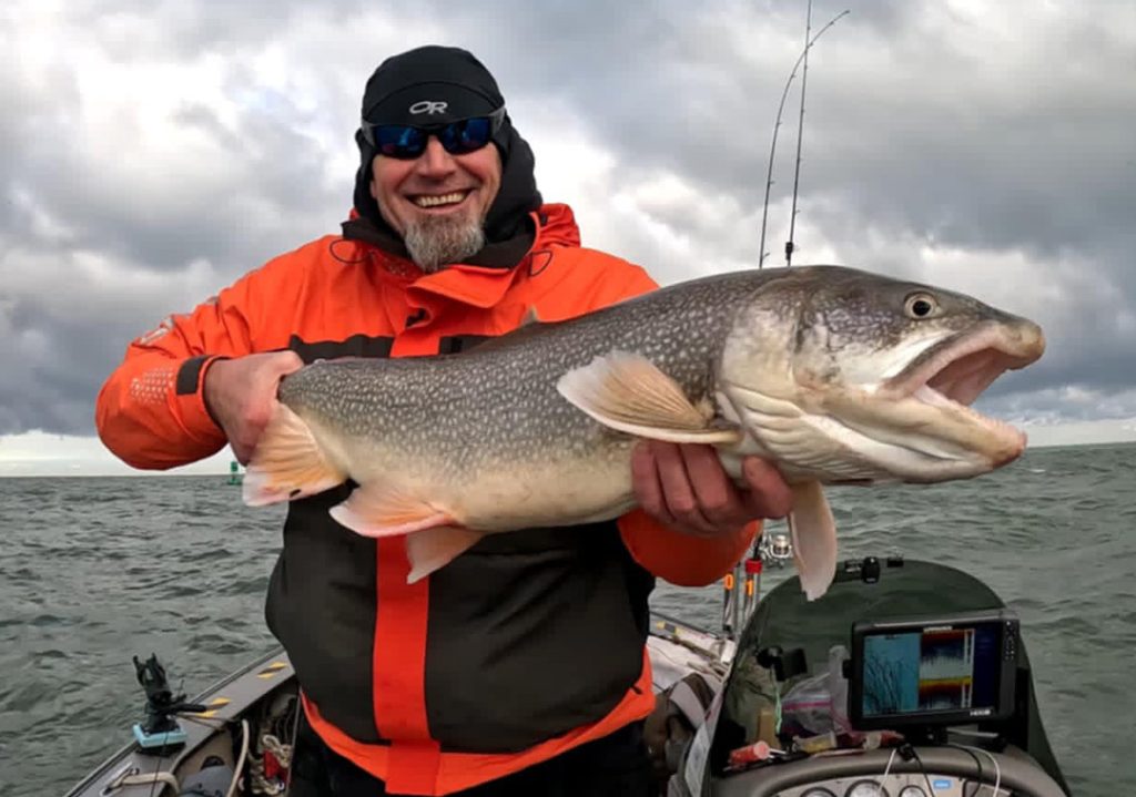 Derrick Krotine with lake trout