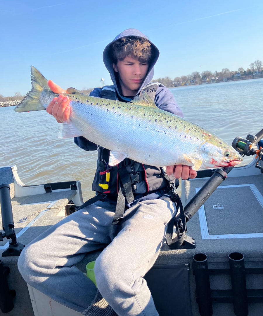 Noah Budde with Atlantic salmon