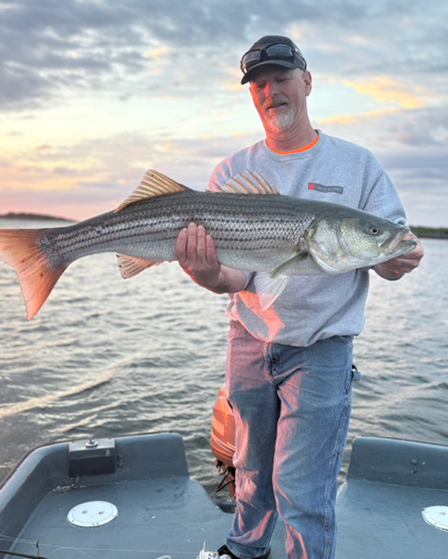 John Picard with striped bass
