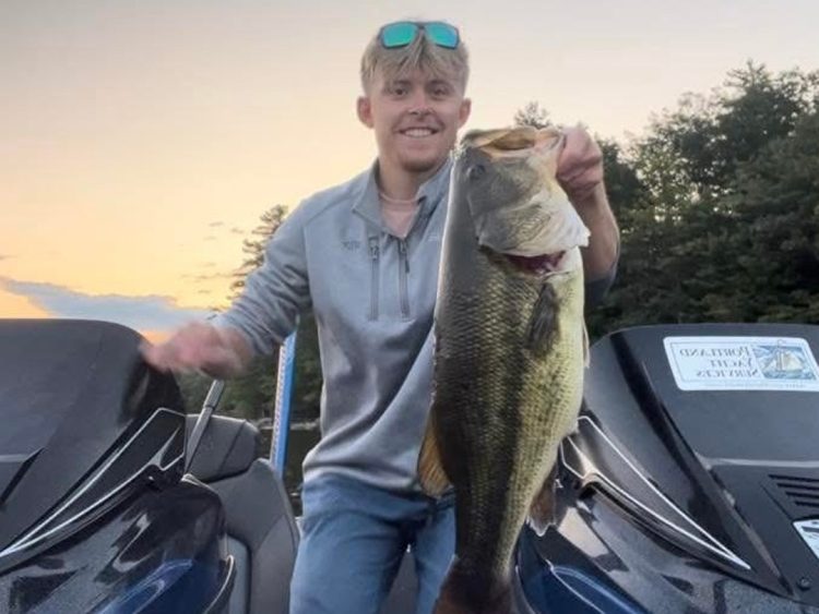 Connor Sirois with Sebago lake largemouth bass