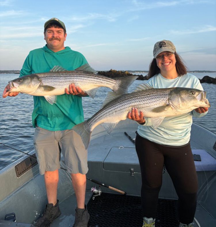 Tyler and Tiffany Thorpe with striped bass