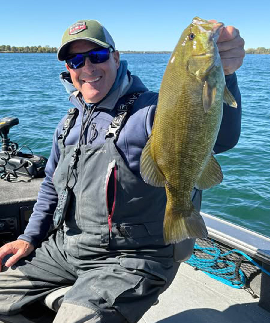Capt. Chris Cinelli with smallmouth bass