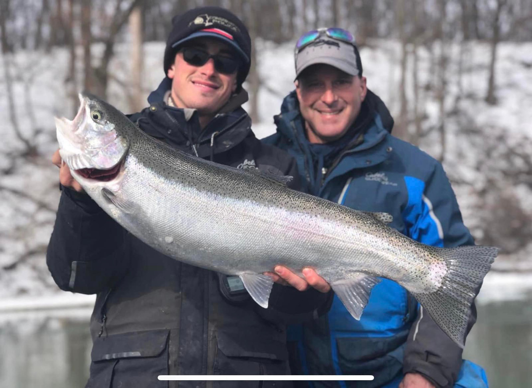 Capt. Connor Cinelli and dad Chris with steelhead.