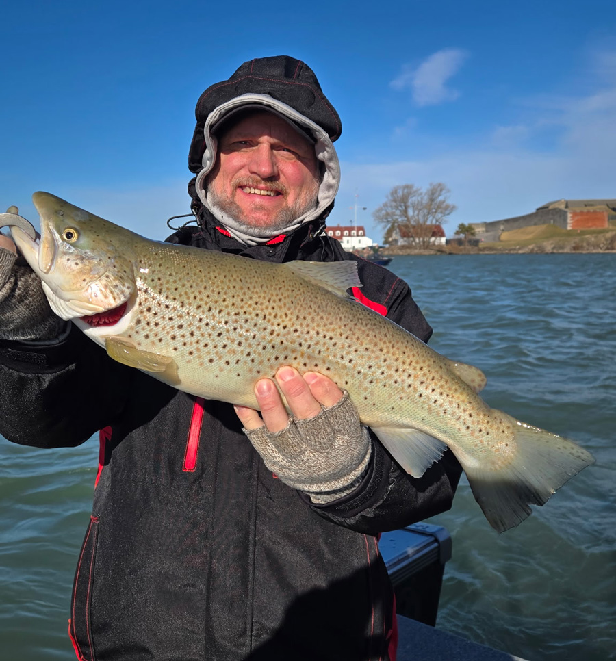 Capt. Jim Steel with brown trout