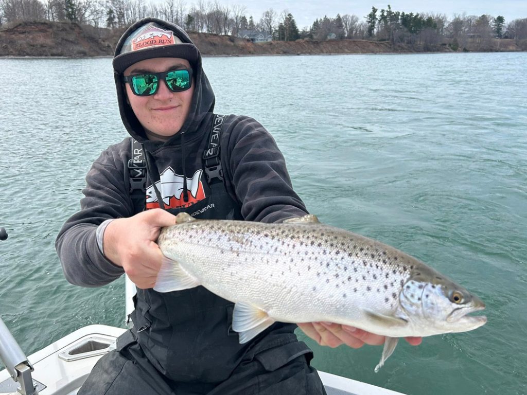 Logan Noon with a brown trout