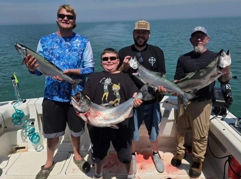 Scipione Fishing Charters anglers with salmon