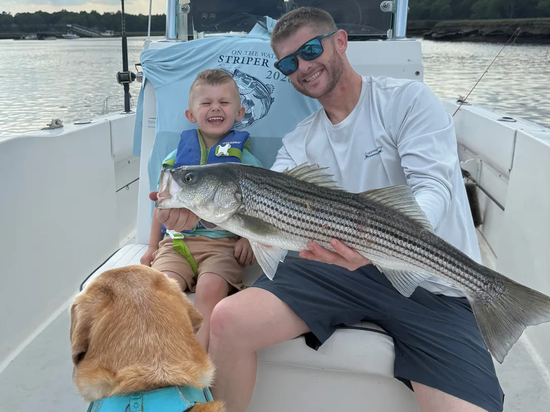 Striper Cup member Mark Joyce with his boy and his dog