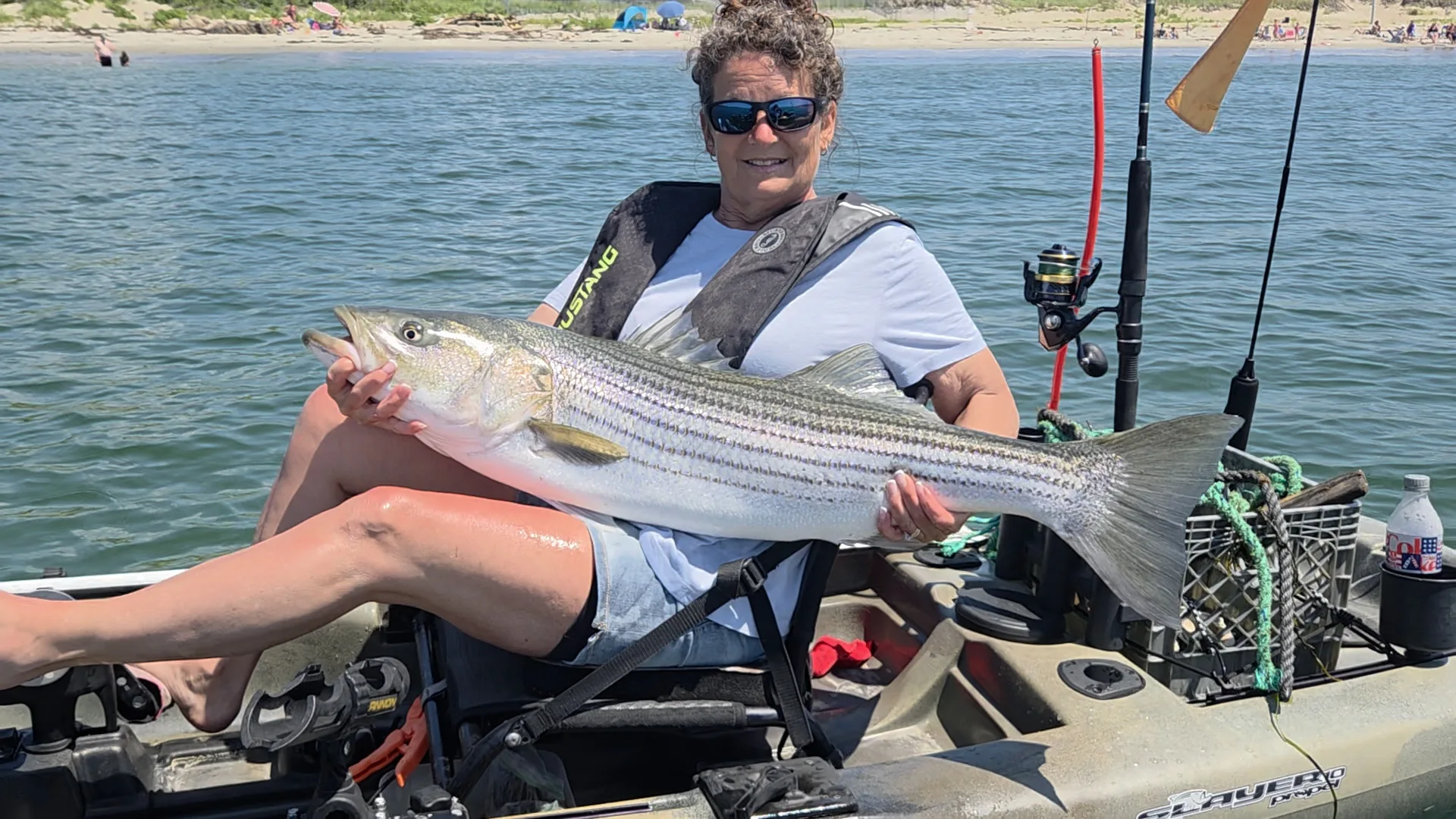 Week 10 Kayak winner Cheri Parker of Warner, NH with her striped bass