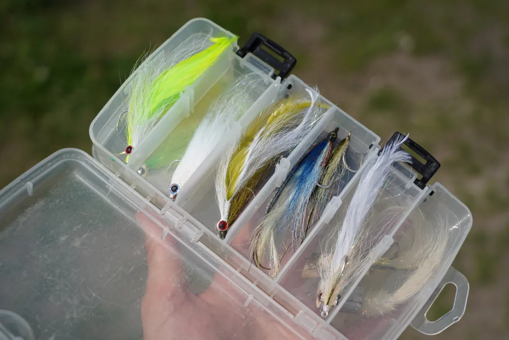 A box of flies for Canadian striped bass is full of Clouser Minnows and Half N' Halfs.