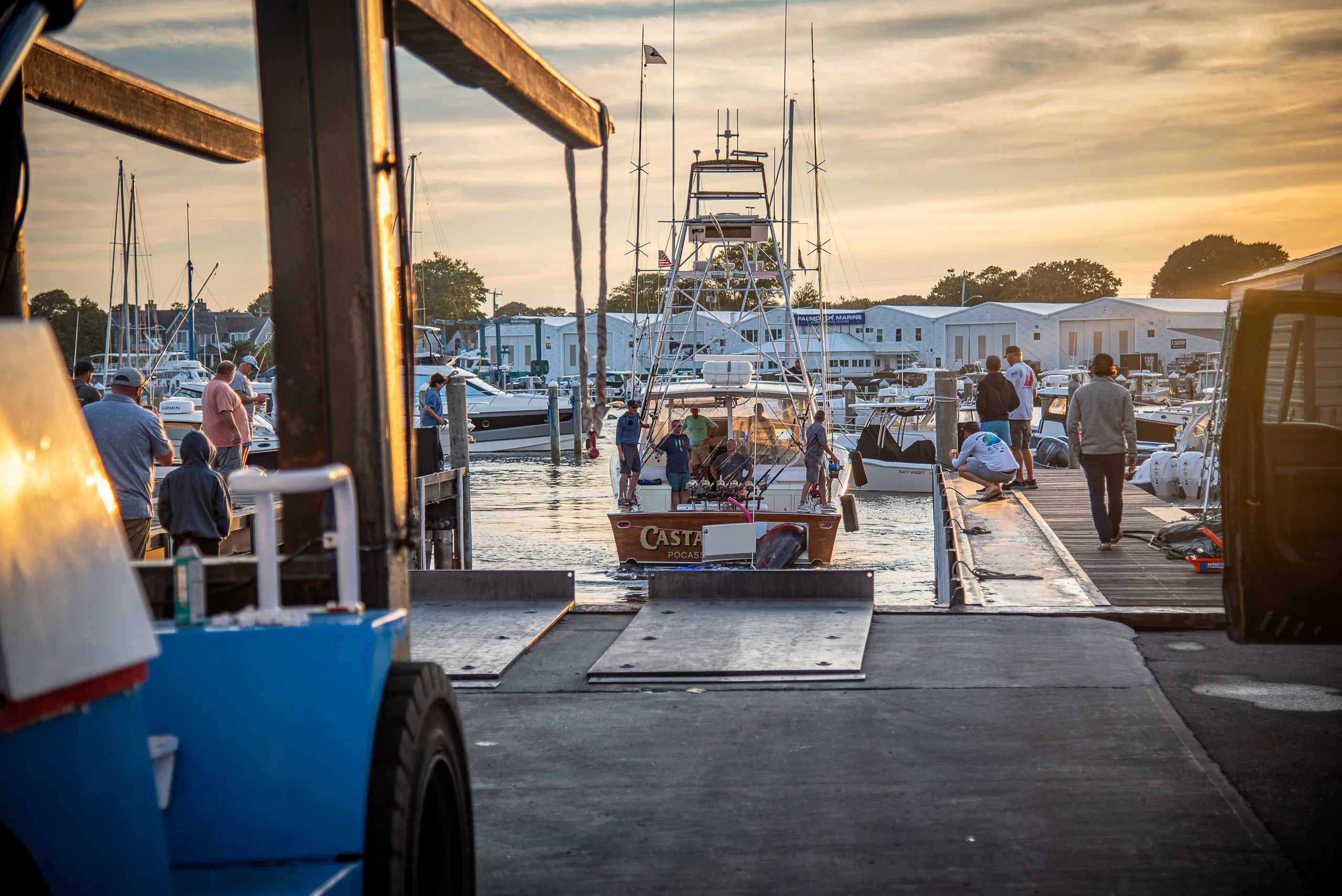 Captain Damon Sacco backs the Castafari up to the weigh station crane at MacDougall's Cape Cod Marine Service
