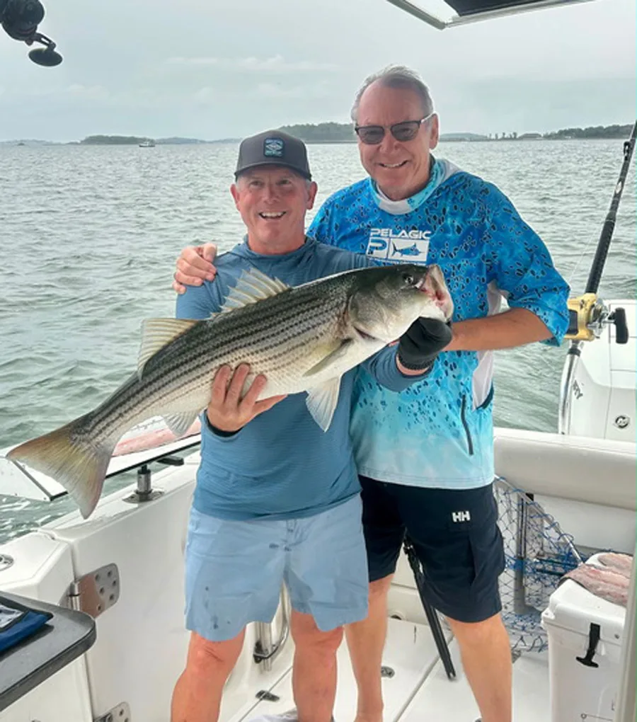 Captain Johnny Walker and Doctor Brick with striped bass