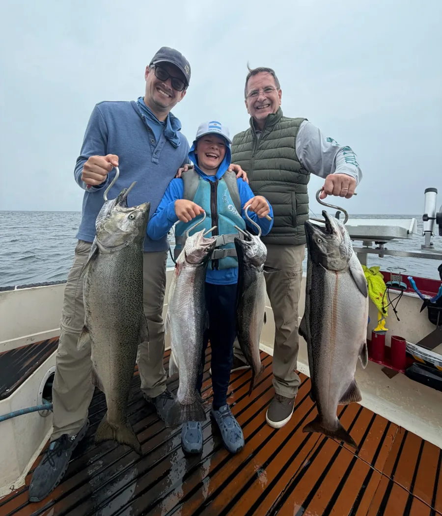 Nicholas, William and Santiago Piuzzi with salmon and trout