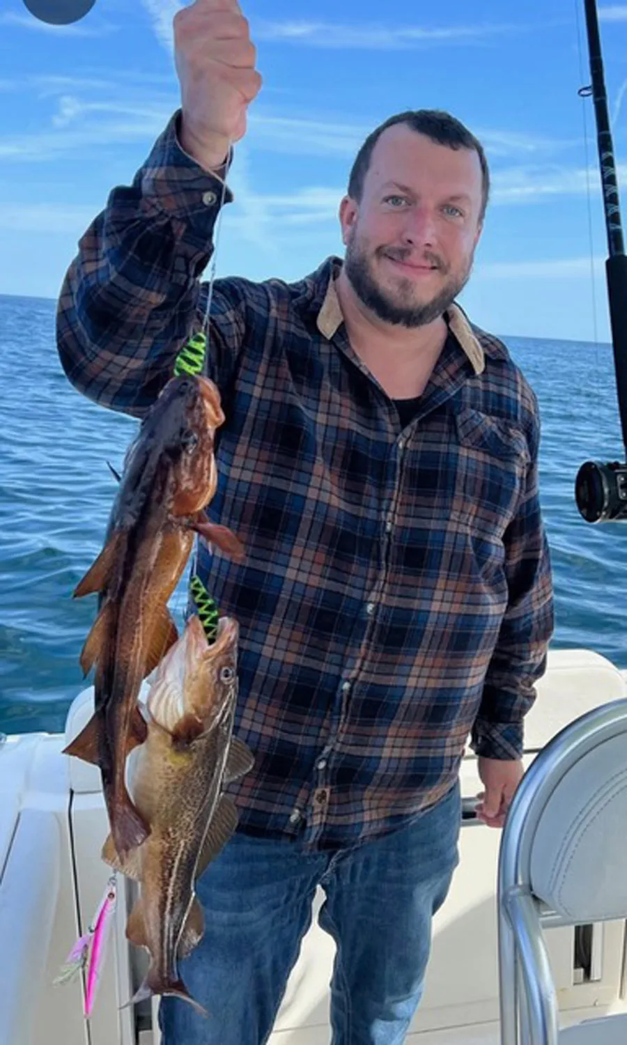 Captain Pat Keith with pair of cod