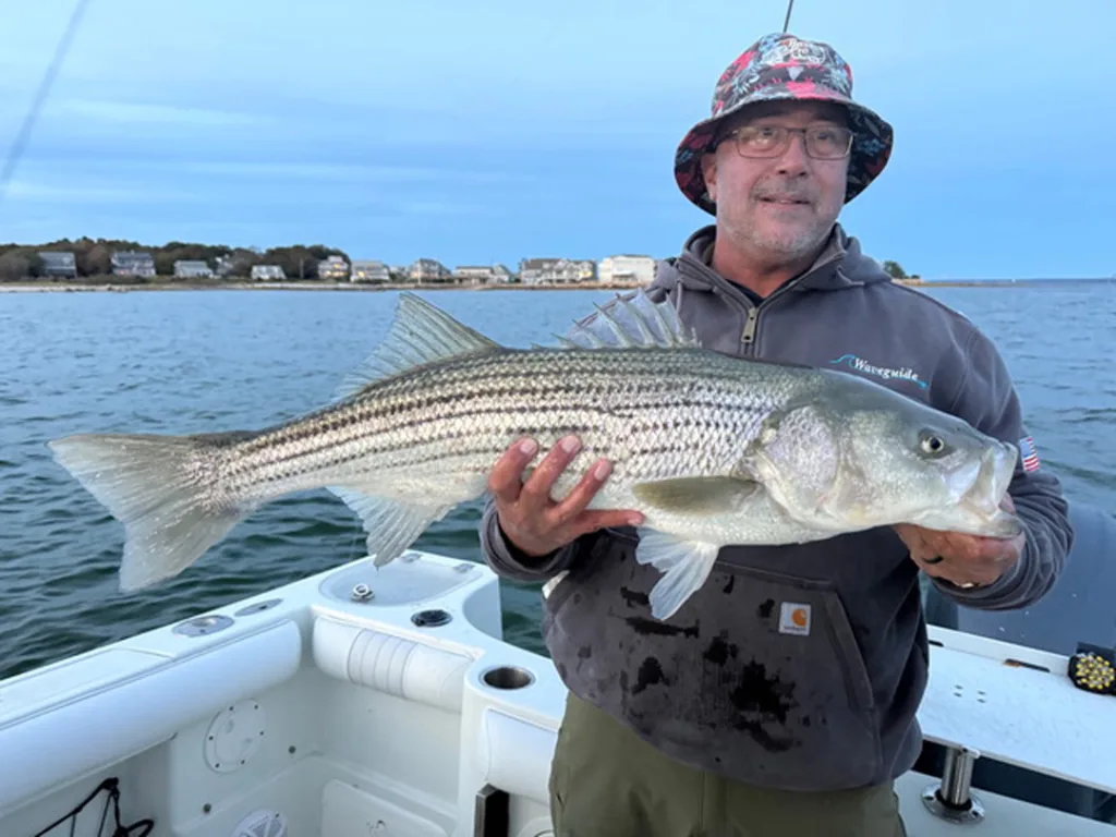 Dennis Aquino with striped bass