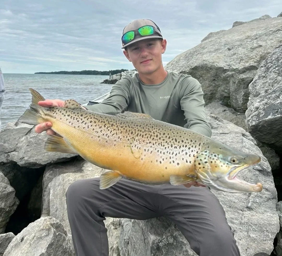 Caleb Castro with a big brown trout