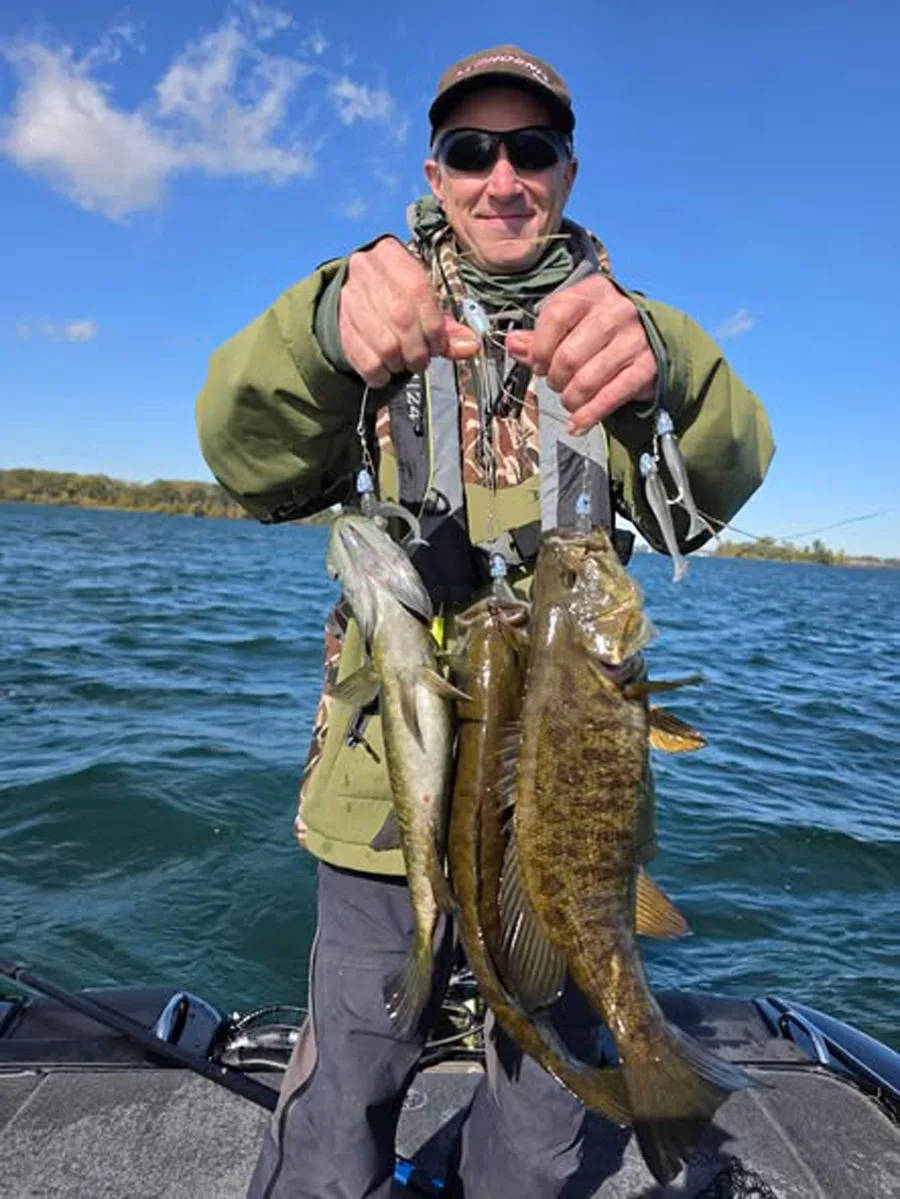 Jeff Hippert with three smallmouth bass